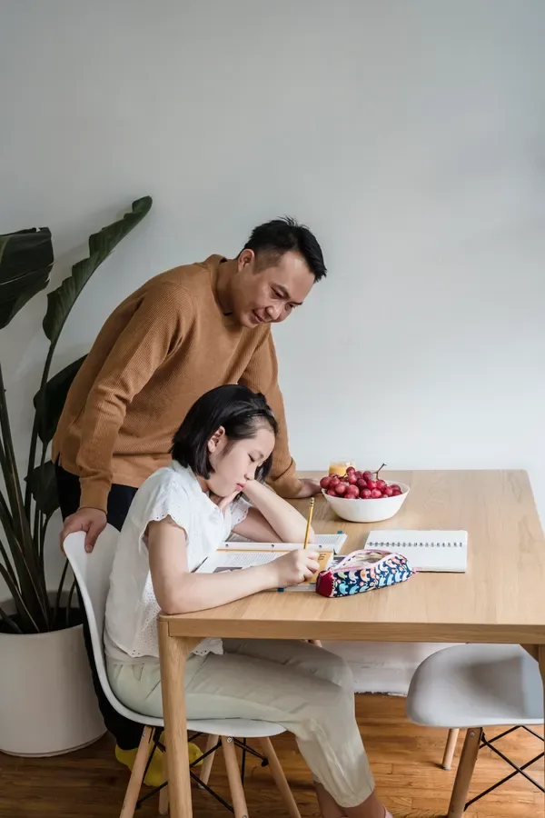 Parent and child planning the next stage of learning together