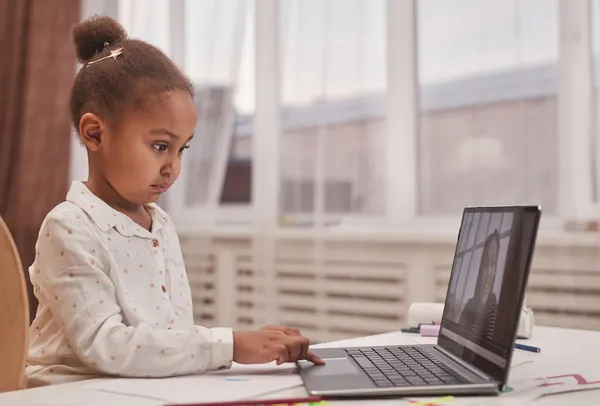 Student concentrating during a one-to-one online lesson