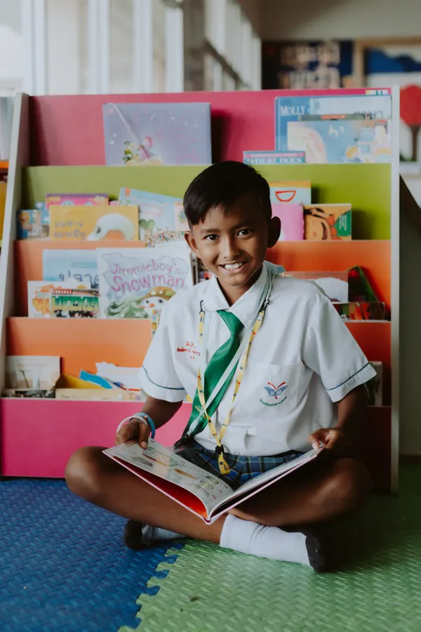 Primary-age learner reading confidently
